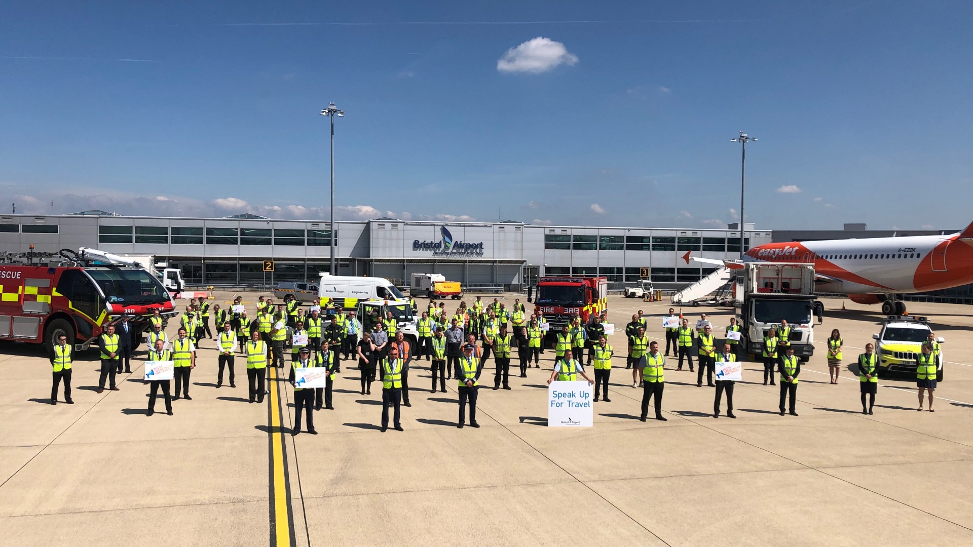  Staff from aviation and travel industries stand on Bristol Airport runway